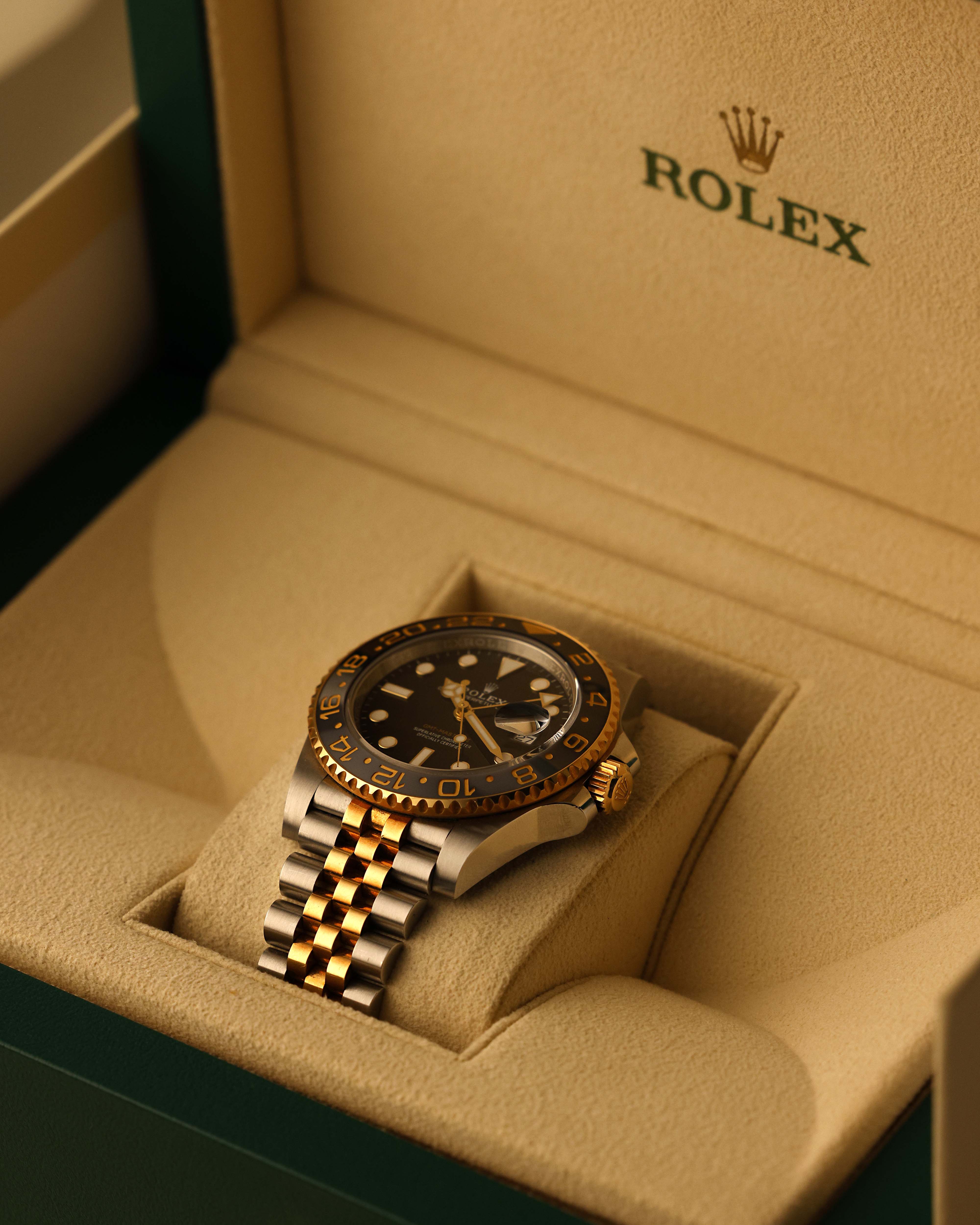 Luxury Rolex watch in golden box