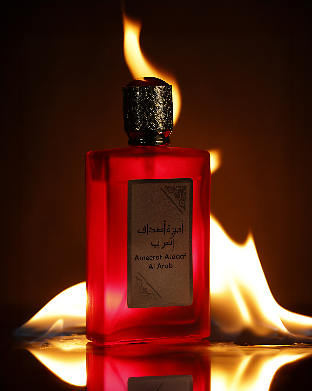Red perfume bottle on black background